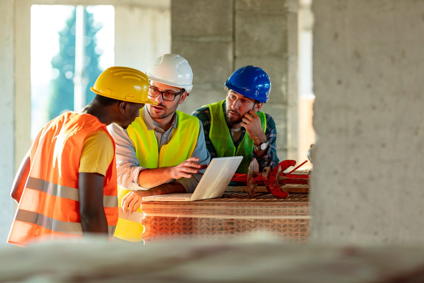 Team of workers collaborating on site